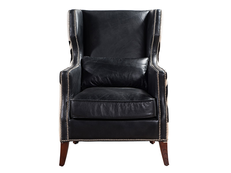 Antique leather armchair and ottoman with Zebra fur